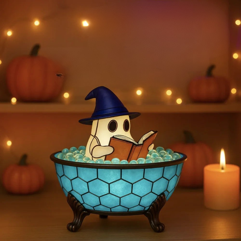 Lighted Halloween ghost figurine reading a book