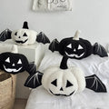 Halloween pumpkin cushion with bat wings