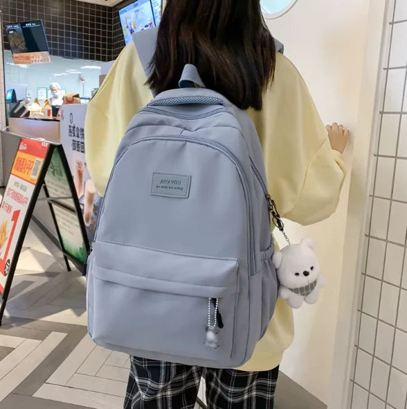 Water-resistant school backpack with multiple compartments for books and laptop