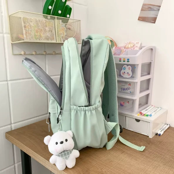 Water-resistant school backpack with multiple compartments for books and laptop