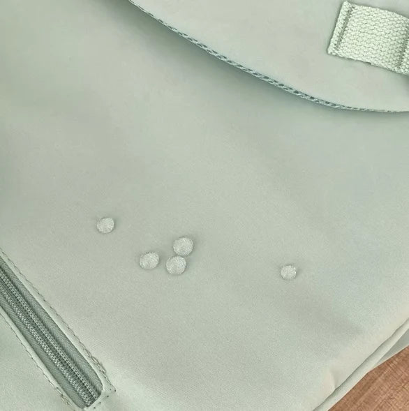 Water-resistant school backpack with multiple compartments for books and laptop